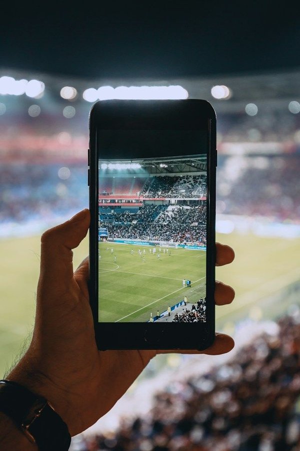 How are sports organizations utilizing social media to enhance global fan engagement?